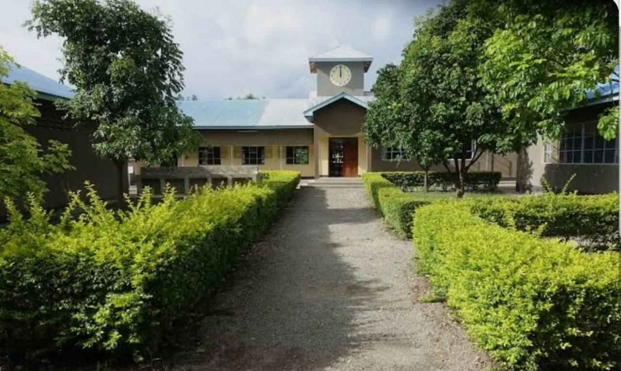 Landscaped pathway leading to Joyland Boys’ Secondary School’s main entrance and clock tower